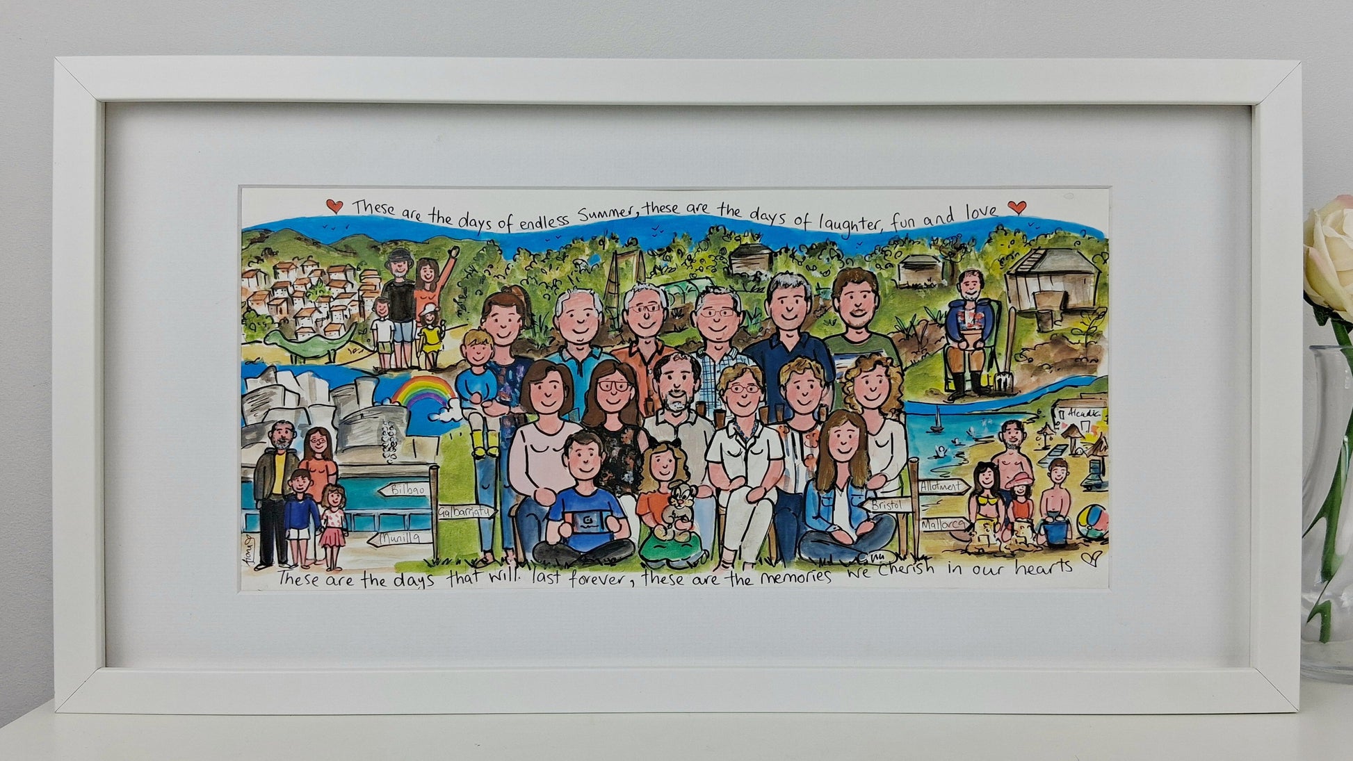 Framed artwork of a colorful illustration of a family group with a scenic background.