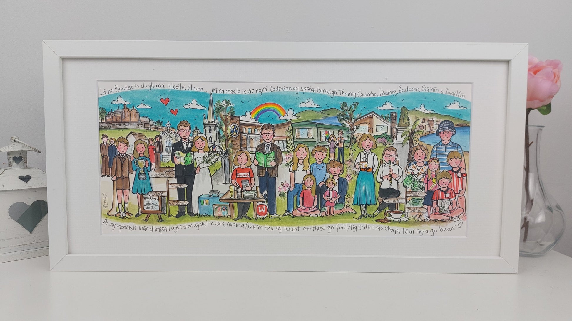 Framed illustration of a wedding scene with people in various outfits and poses, set against a colorful background.