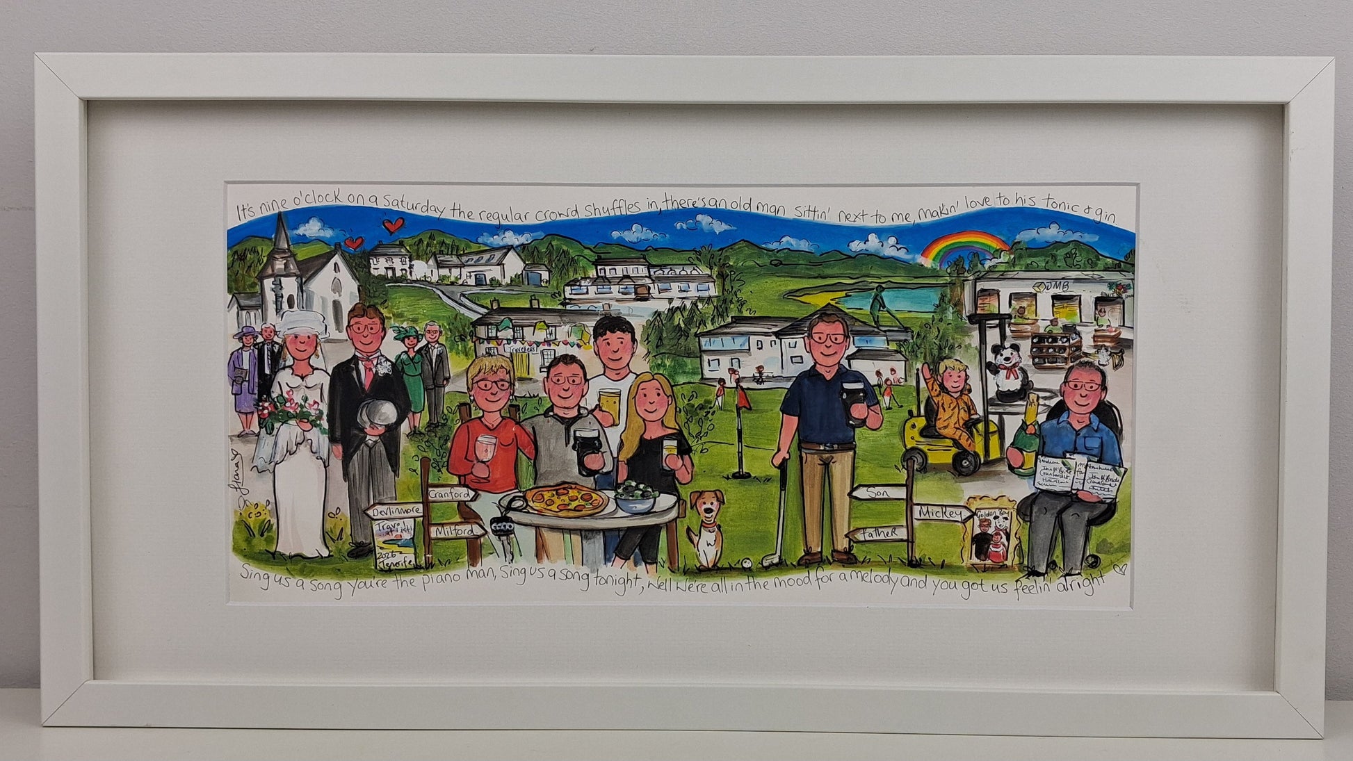 Framed artwork of a group of people sitting outdoors with a scenic background.
