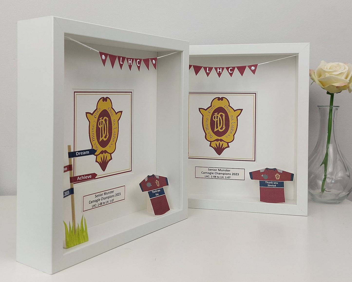 Shadow box with sports team memorabilia including a crest, jersey, and decorative elements.