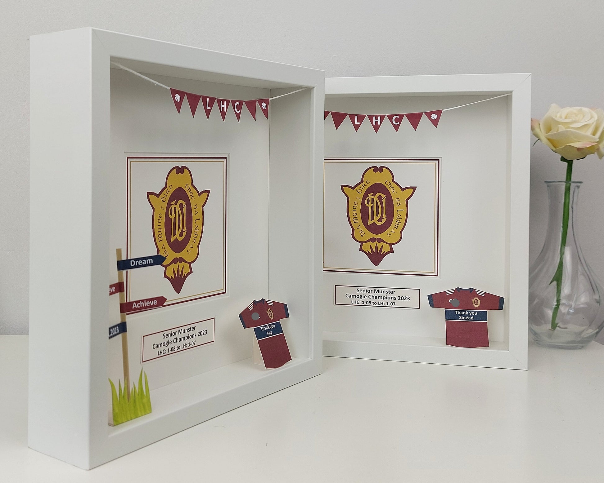 Shadow box with sports team memorabilia including a crest, jersey, and decorative elements.