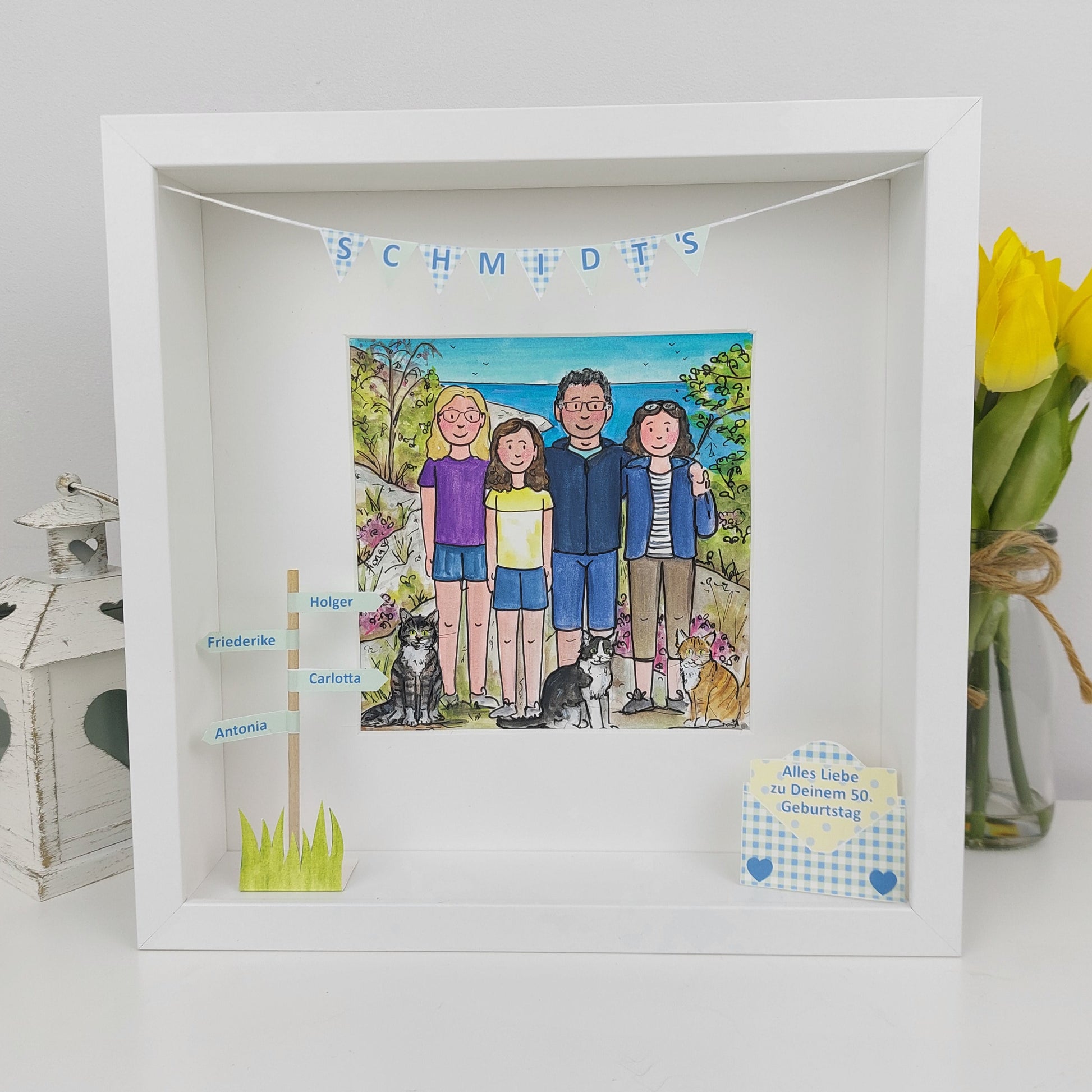 White framed artwork with a family portrait and personalized names, 
in a box frame with 3d personalised paper features