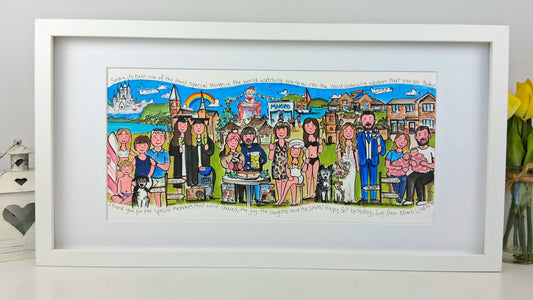 Framed illustration of a family gathering with a white frame on a light-colored surface.