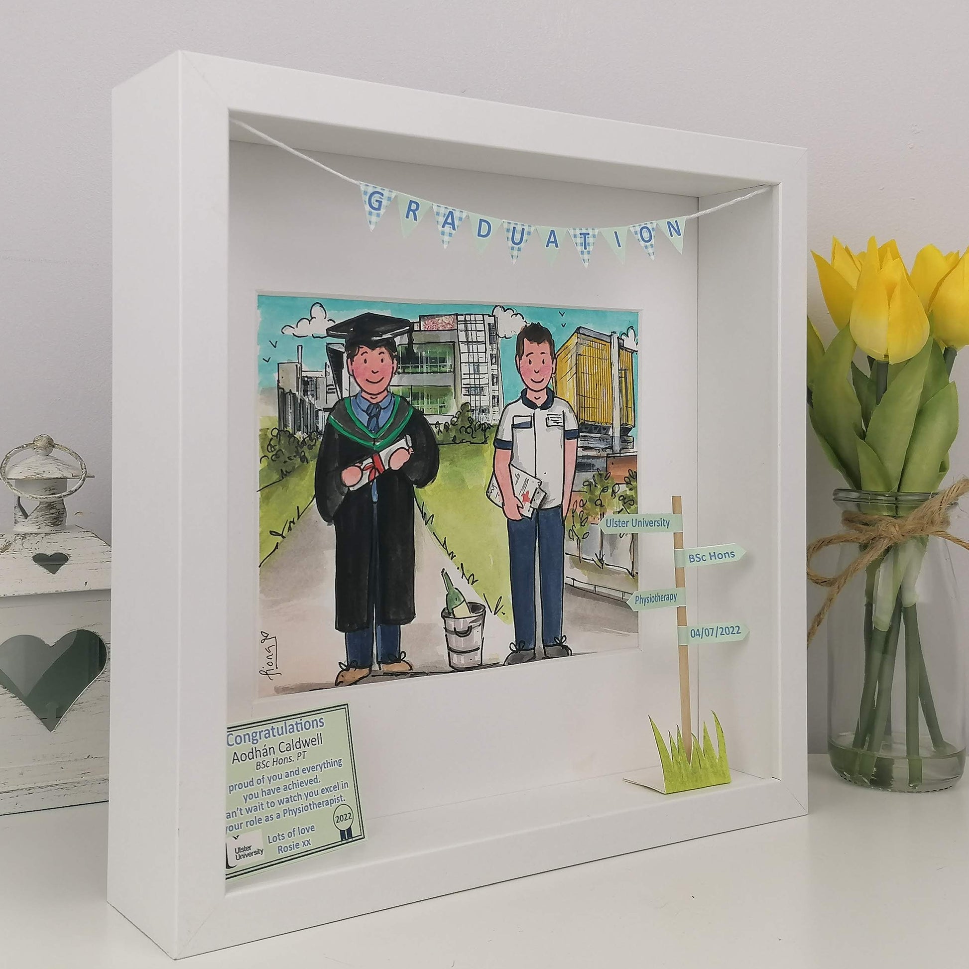 Graduation-themed shadow box with a photo of two people one in graduation attire, and 1 and a nurse doctor - with personalised congratulations