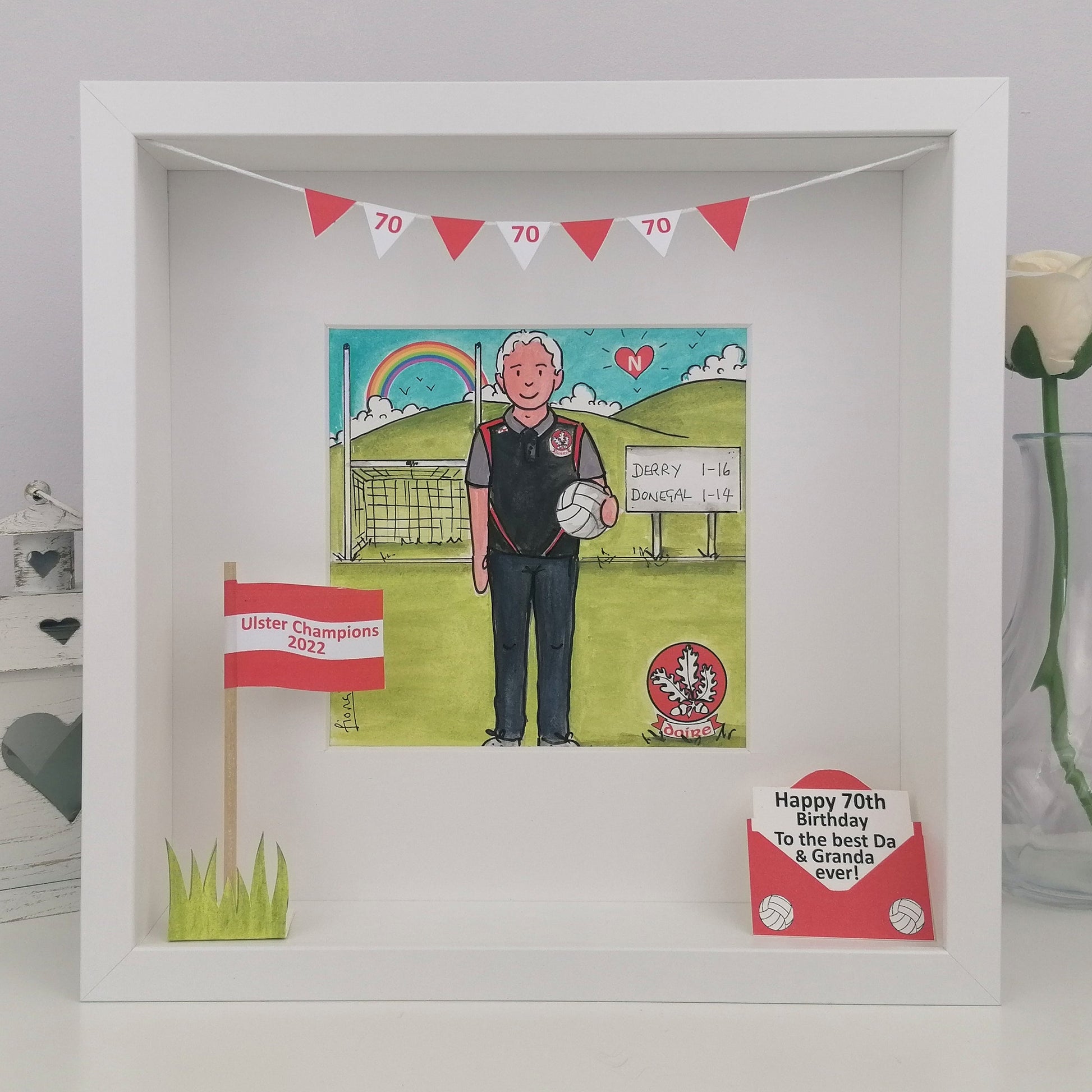 Framed artwork with a man on a soccer field, celebrating a 70th birthday.