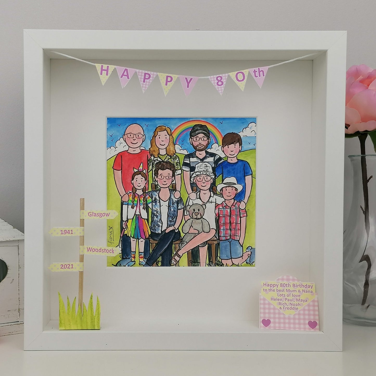 Framed illustration of a family with a rainbow and 'Happy 80th Birthday' banner.