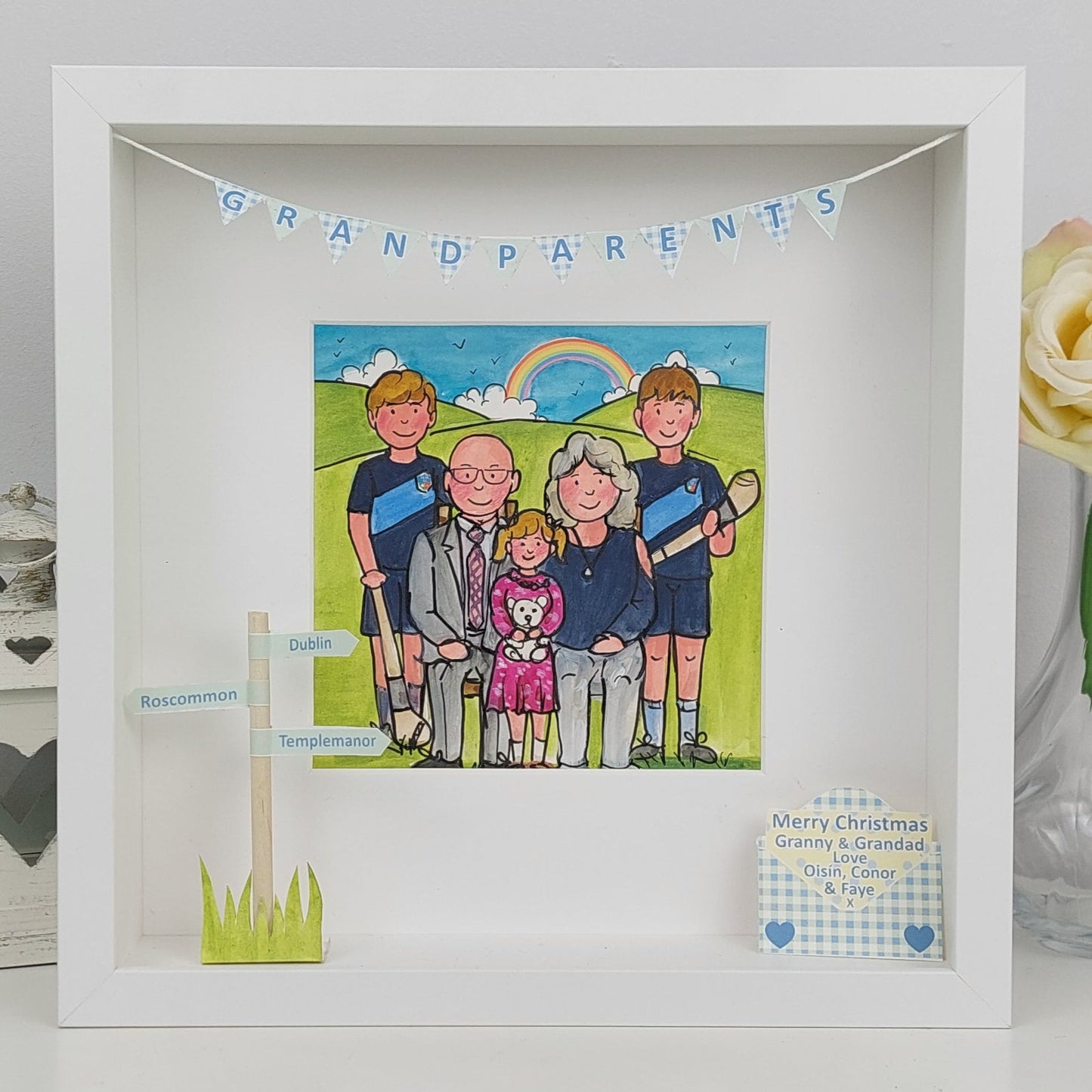 Framed artwork of a family with 'Grandparents' text on a white background