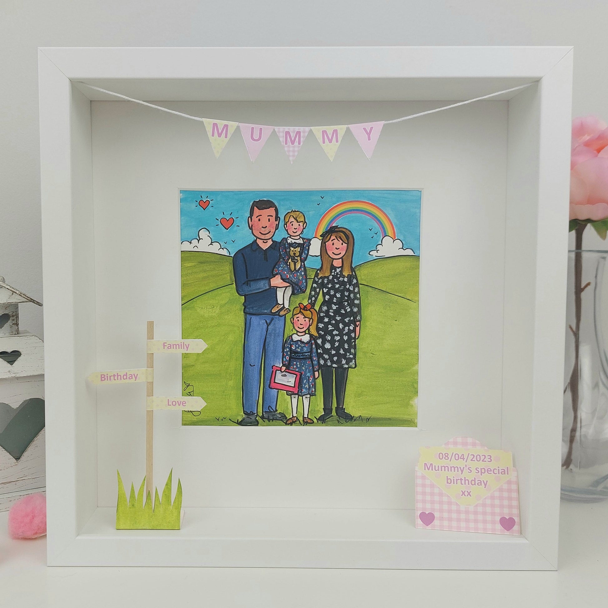 Framed illustration of a family with a rainbow and 'Mummy' banner. A cute colourful illustration with children and mum and dad