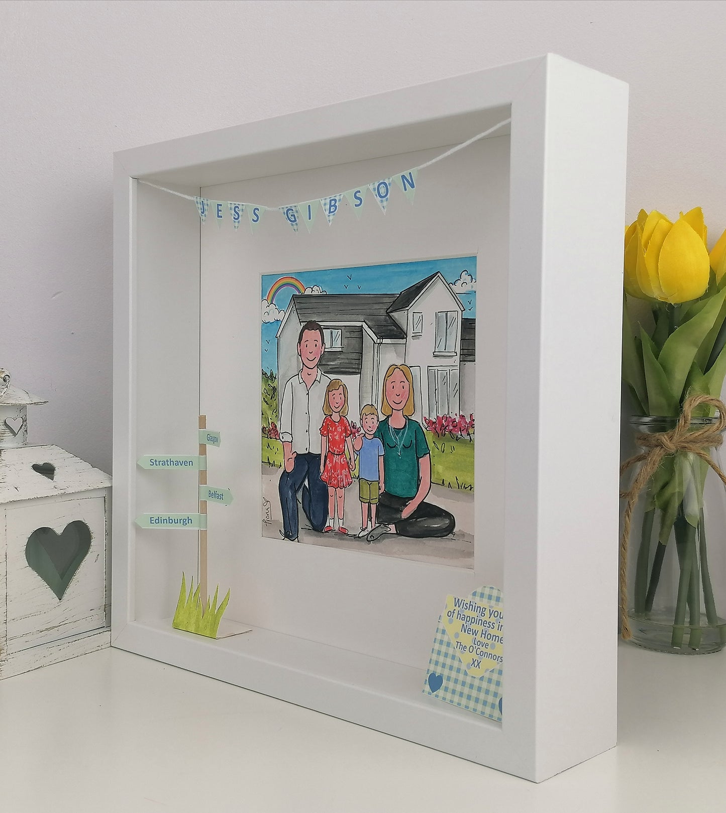 White shadow box with a family illustration and text,
