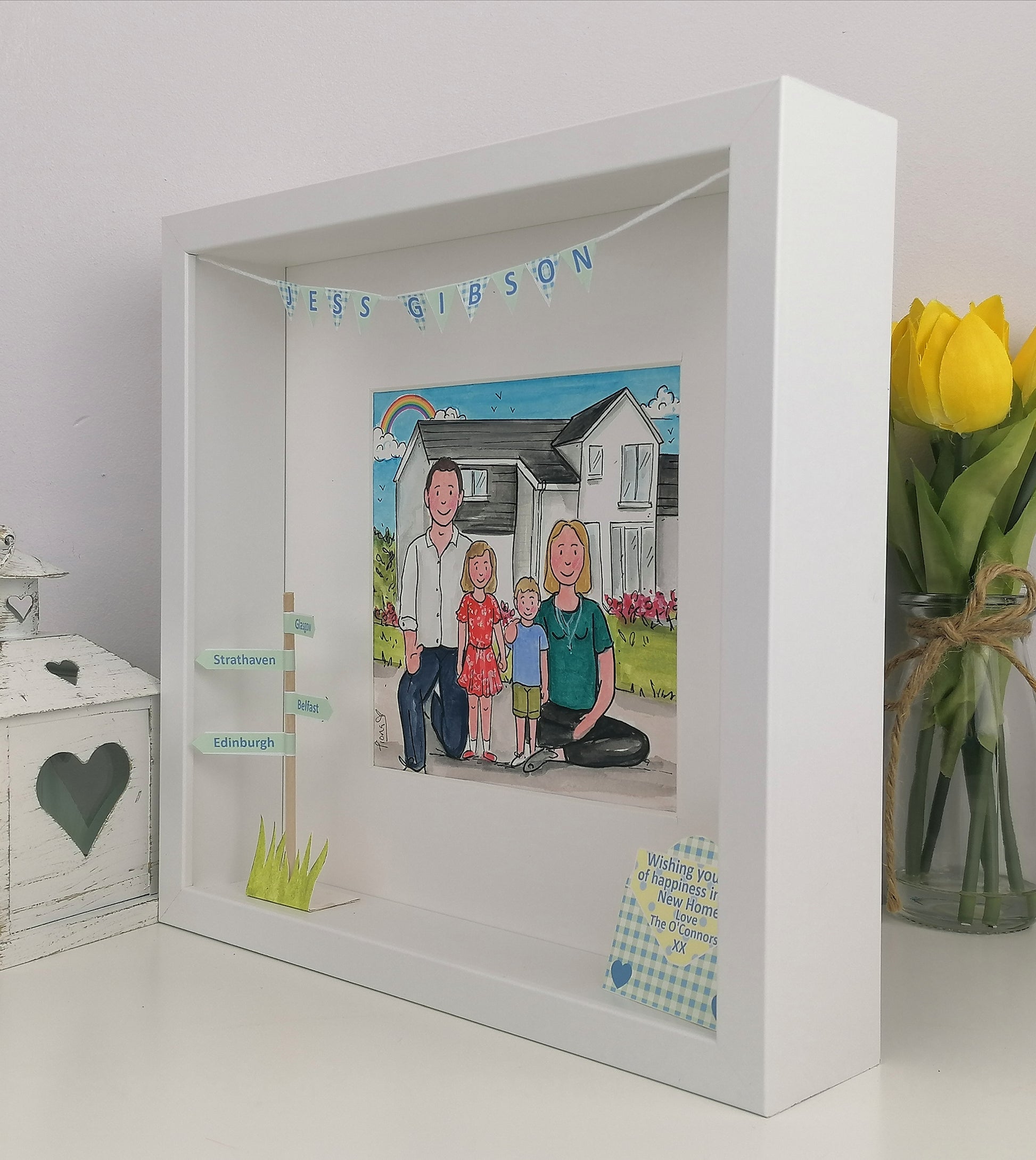 White shadow box with a family illustration and text,
