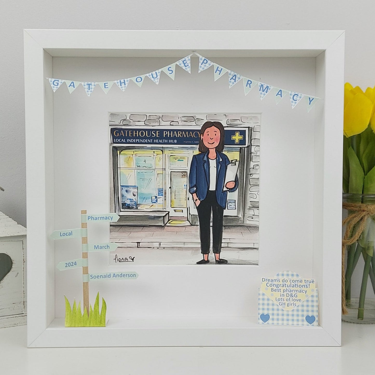 Framed artwork of a pharmacist in front of 'Gatehouse Pharmacy' in a box frame