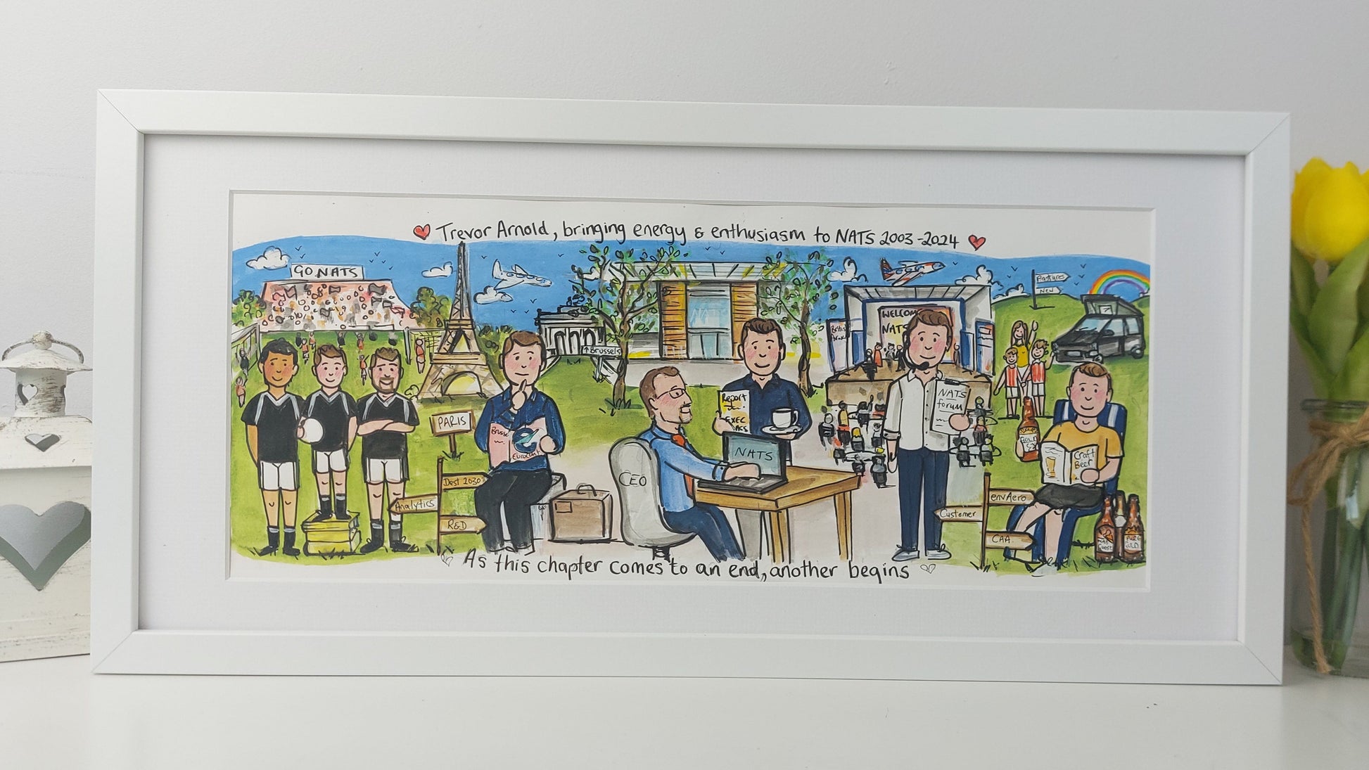 Framed artwork with cartoon characters and text on a white surface.