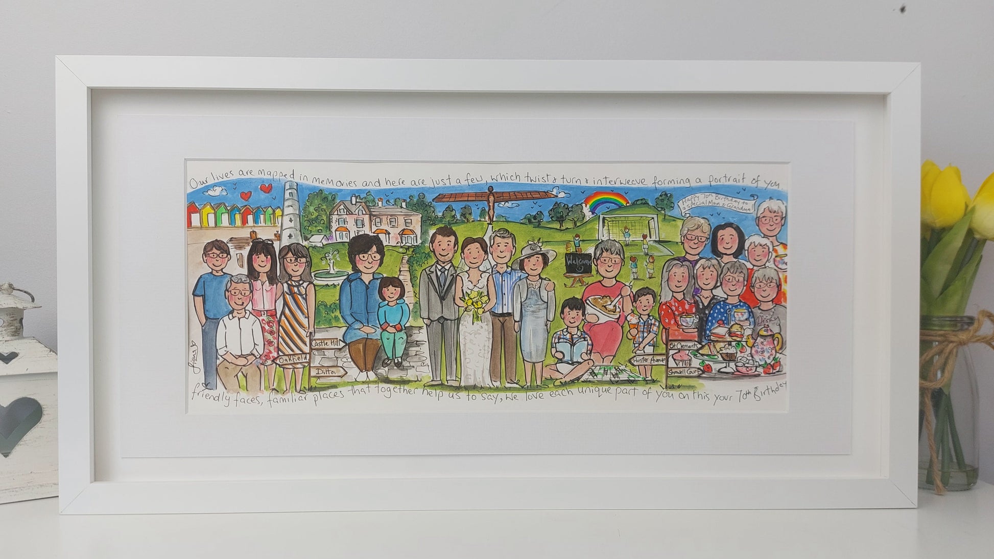 Framed artwork of a family portrait with various scenes and people.