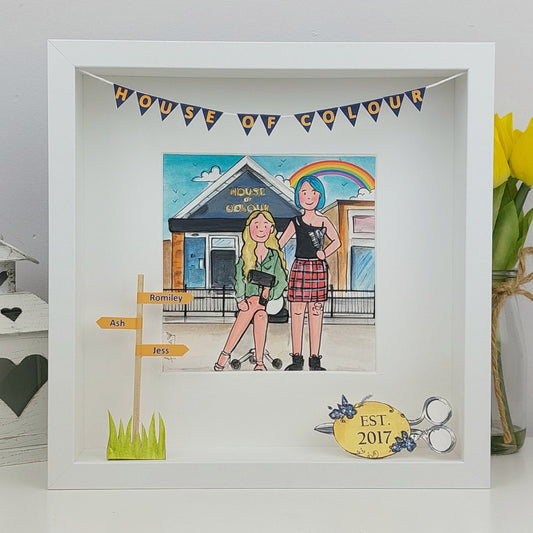 Framed artwork of two people in front of a salon with decorative elements, including a rainbow and text.
