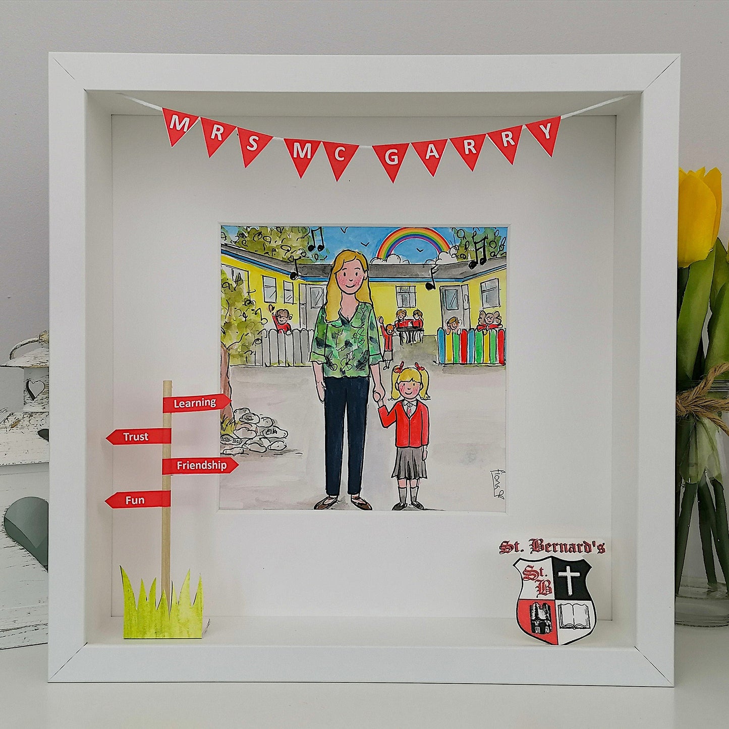 A personalized illustration of a teacher with children in front of a school, framed in a white box frame.